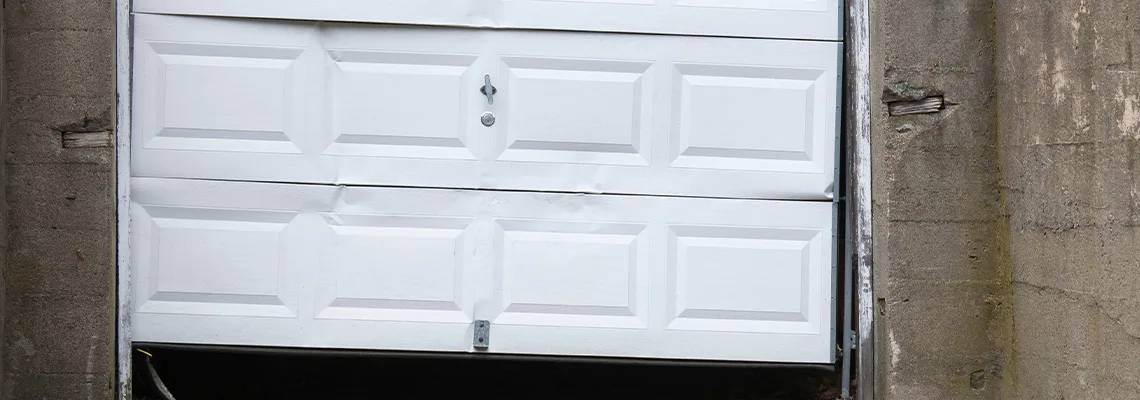 Garage Door Got Hit By A Car Dent Removal in Margate, FL
